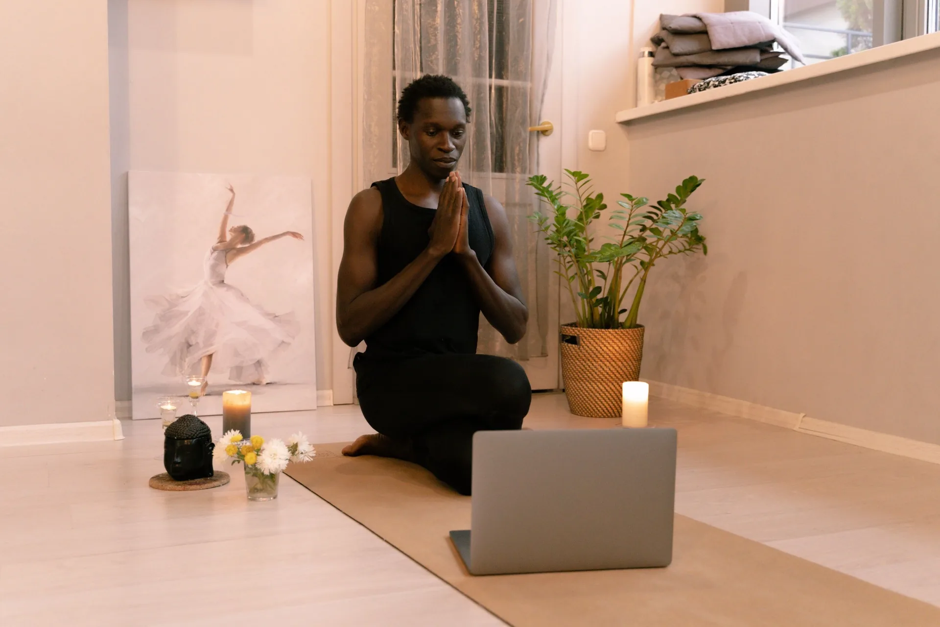 Person meditating at home during a virtual Reiki session